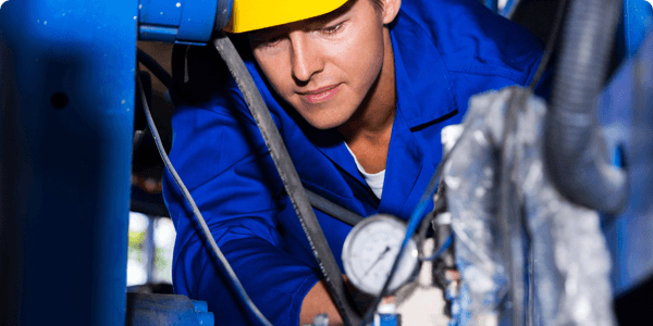 Technician working on site calibrating pressure gauges